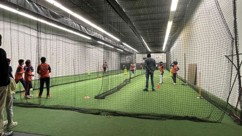 Youth academy practicing spin bowling